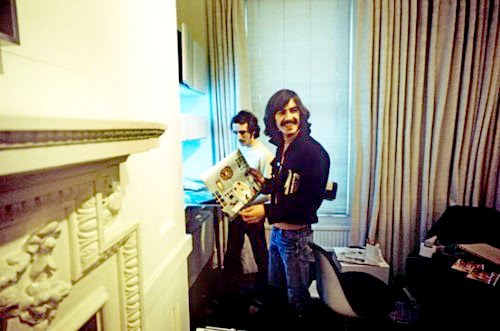 Beatles. Geo. Harrison in the Apple office with Jack Oliver. This was 1n 1969.